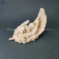 Hand holding Baby On Feather Size 12.5x10cm